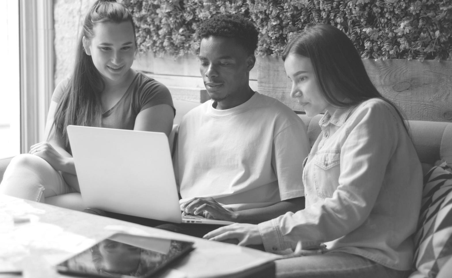 Students collaboratively analyzing financial metrics and discussing business performance indicators